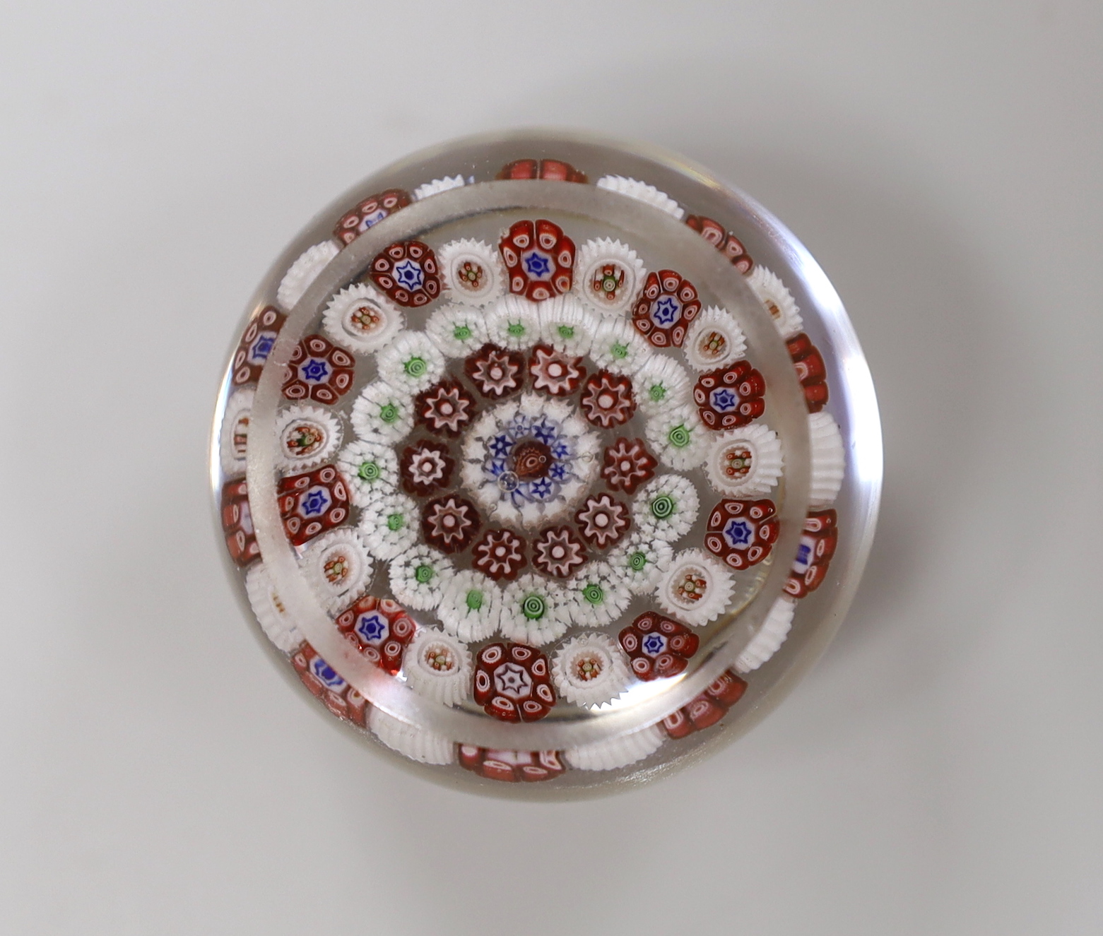 A Baccarat concentric millefleur cane paperweight, approximate diameter 4.25